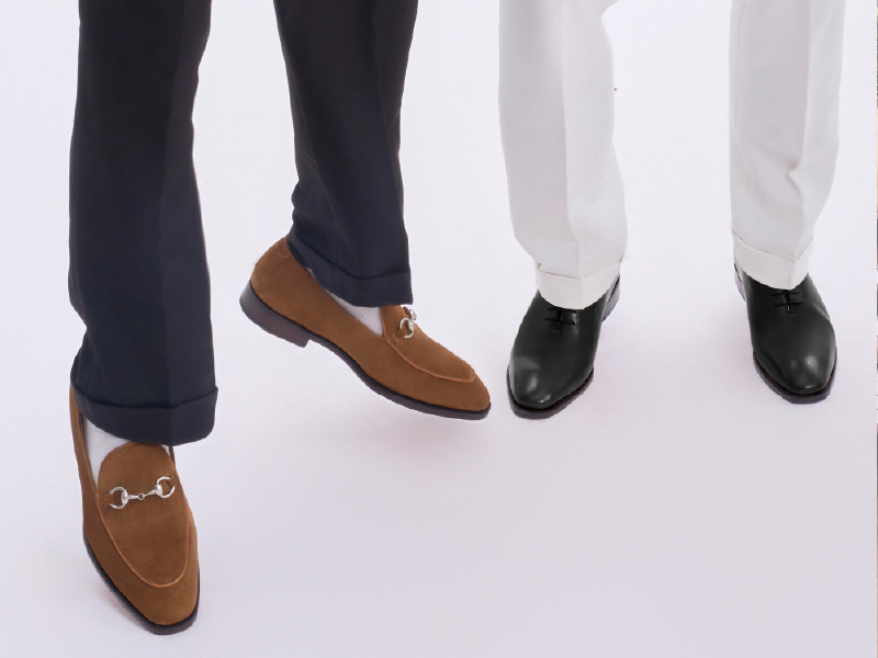 brown and black leather Oxfords side by side