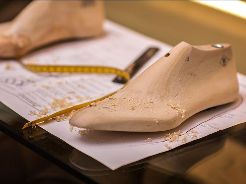 hand-lasting handmade shoes on a last