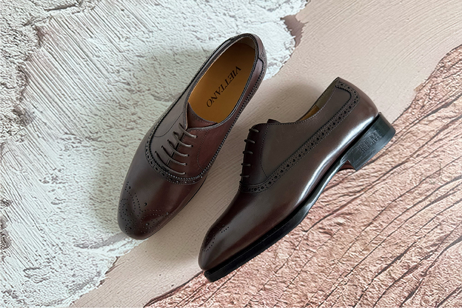 A wide forefoot bulging over the edge of a too-narrow leather sole